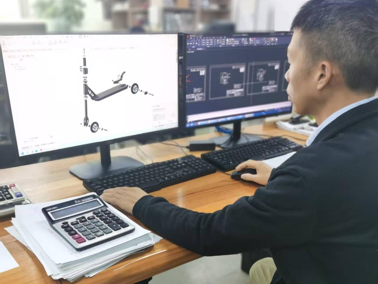 Aixi Sports R&D engineer working on stunt scooter design with 2D CAD drawings and 3D modeling software on dual monitors